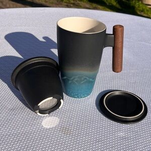 Ceramic tea mug and infuser, with lid. mountain landscape, wooden handle